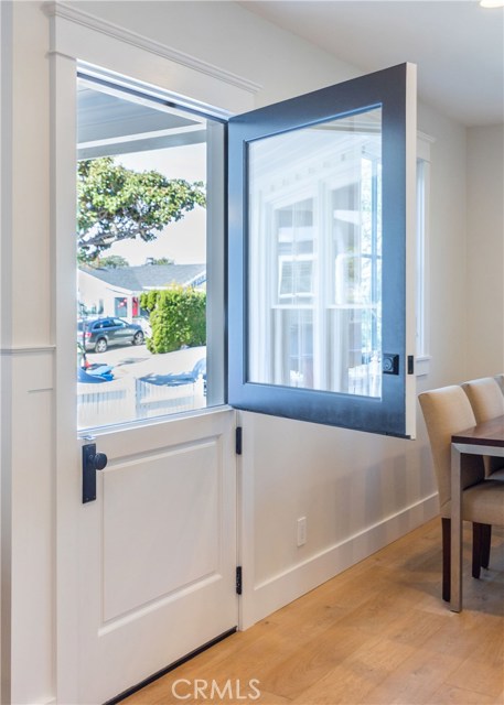 The Dutch door at the entry brings cool breezes and a touch of whimsy to a home filled with comforts.