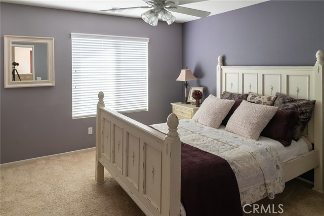 Upstairs bedroom with walk-in closet and mirrored closet door