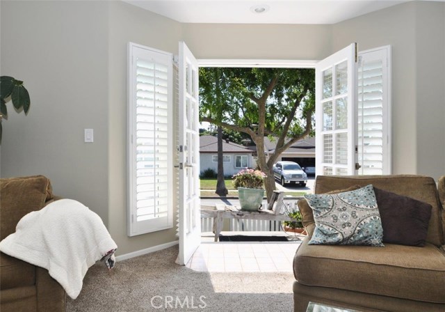 French doors open to the side yard and cooling ocean breezes