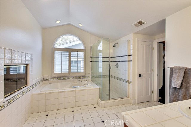 En-suite bathroom is super spacious and has separate spa tub, shower, twin vanities and large walk-in closet.