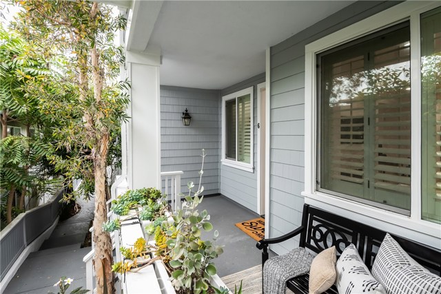 Welcoming roomy front porch with garden boxes.