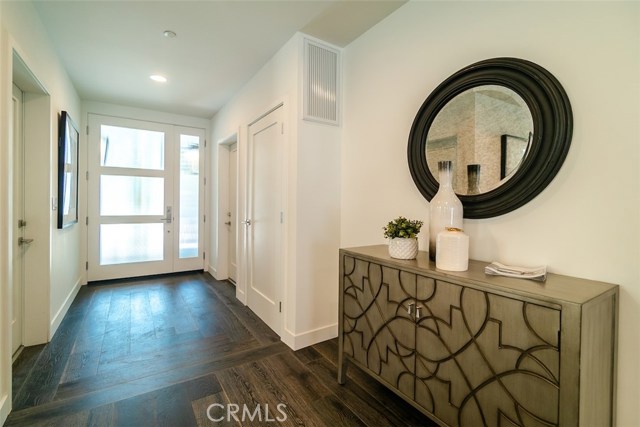 Entryway with European oak floors compliments this brand new home's casual contemporary style.