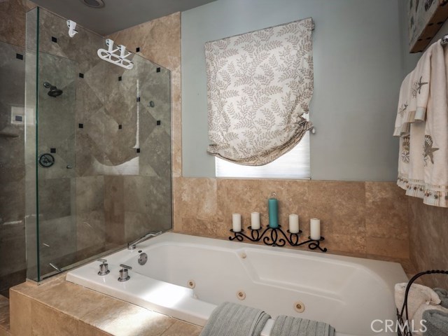 Jetted soaking tub and walk in shower are found in the master en-suite bath.