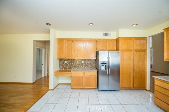 Kitchen with tile floor, Frigidaire refrigerator 7 recess lighting