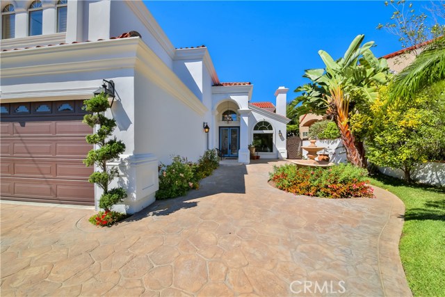 Grand front entryway with mature landscaping. New Exterior paint