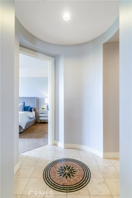 Mosaic tile floor at master bedroom entrance.