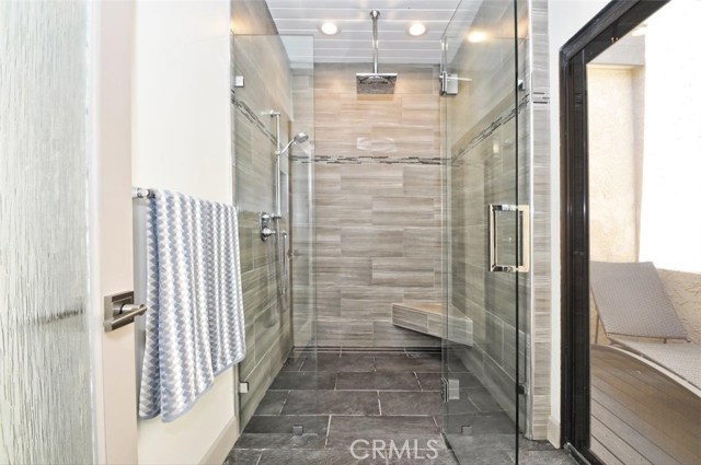 Luxurious rain head walk-in shower with solarium