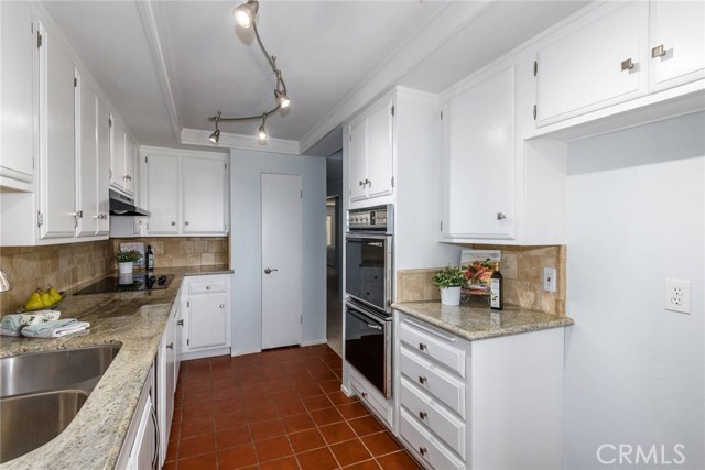 Kitchen with nice pantry.