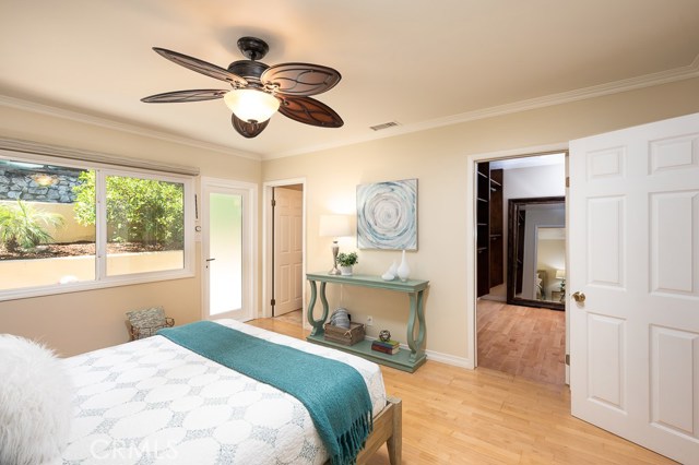 Premier bedroom with en-suite remodeled bath and walk-in closet with built-in shelving.