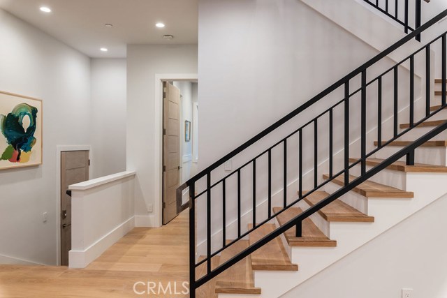 Step down into spacious garage, step up to 4 bedroom suites, family retreat and laundry room