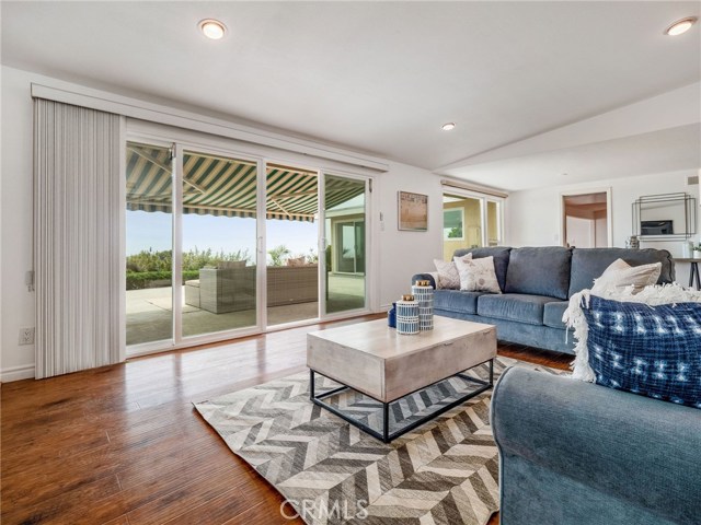 Living Room from corner looking out to Patio and Views