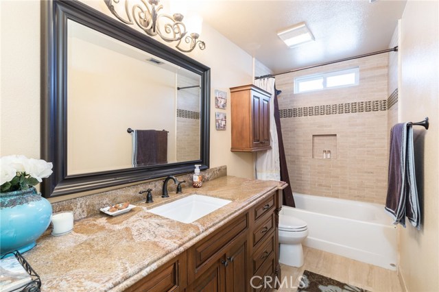 Bathroom 2 – Dark Adler Soft Close Cabinets, Kohler Sink, Granite Counters, Bronze Fixtures and Mosaic Tiled Shower in Tub
Bathroom 2 – Dark Adler Soft Close Cabinets, Kohler Sink, Granite Counters, Bronze Fixtures and Mosaic Tiled Shower in Tub