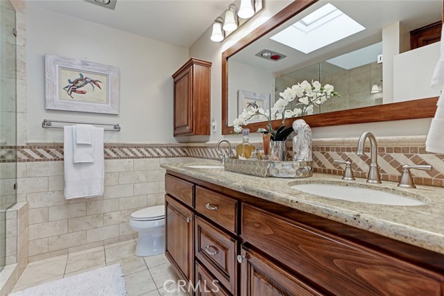 Remodeled master bathroom with dual sinks.