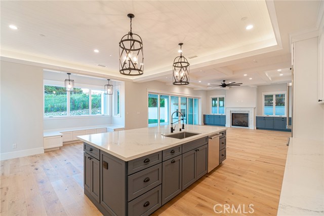 View of kitchen, breakfast nook and family room from Butler's pantry area.