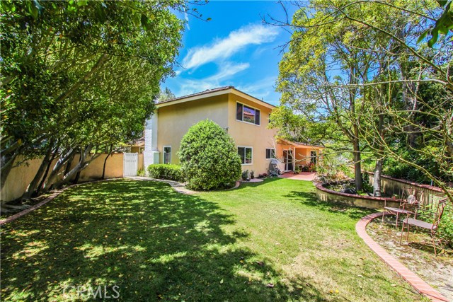 Lushly landscaped, spacious rear yard