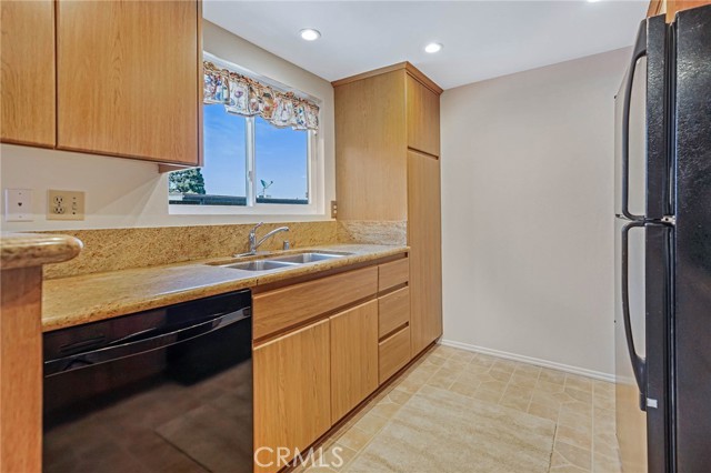 Lots of Storage and a Dishwasher.  Window overlooks Patio and then the Park Like setting in the complex.