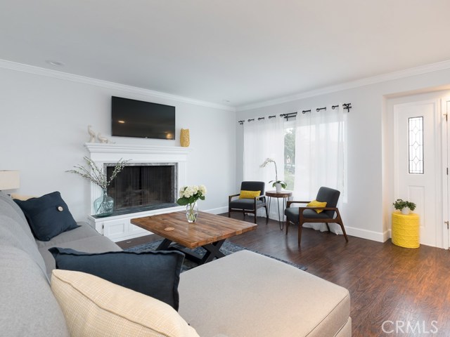 Living room with fire place and peek-a-boo view of harbor
