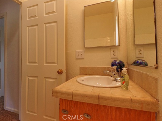 Second bathroom is located at the end of the hall between 2nd and 3rd bedrooms