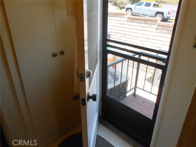 Utility Room Exit/Entrance Door with Screen Door. Also take a look at that Extra Tall Utility Closet at Left side of Picture.