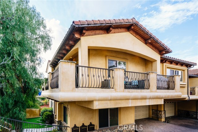 The home's profile is spectacular and enchanting, with the character-filled Mediterranean detail, and the outdoor living space in the balcony.