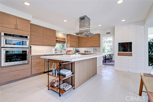 Casual  eating at the kitchen island can easily seat five.