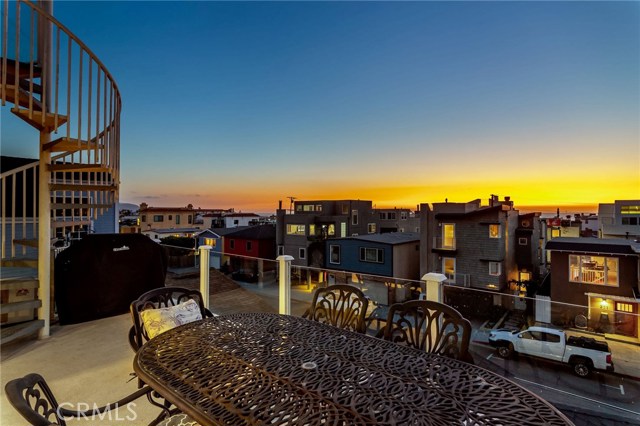 Grilling and watching the sun kiss the ocean from your balcony.