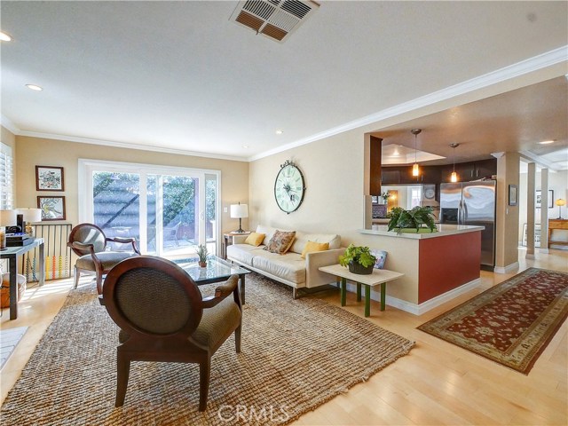 Family room just off the kitchen leads out to the backyard.