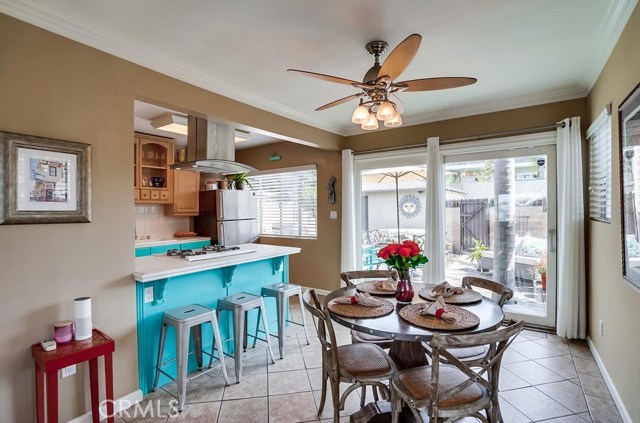 View of dining area and kitchen w lots of light