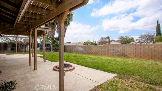 Covered patio and Block wall are some of the features of this home.