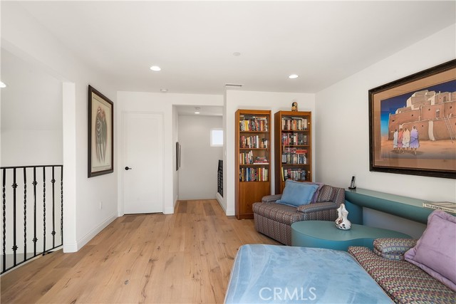 The Mezzanine has sliders and a balcony to the westside and a full bathroom at the east side