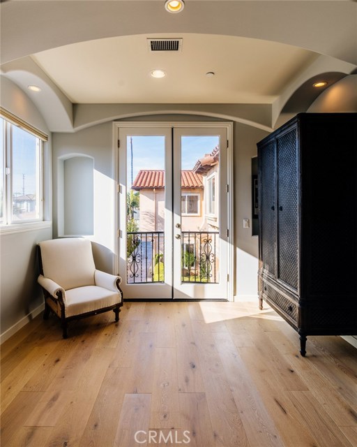 Sitting area and balcony with French doors, in Master Suite.