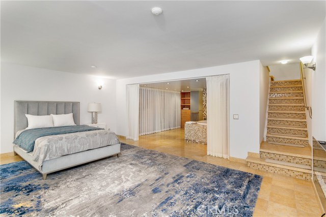 Luxurious, commodious bedroom with look toward dressing area