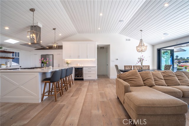 Wire brushed white oak flooring and designer light fixtures throughout