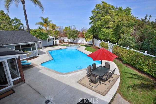 Backyard with beautiful pool and jacuzzi