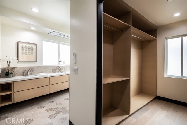 Walk in closet and bathroom in master bedroom