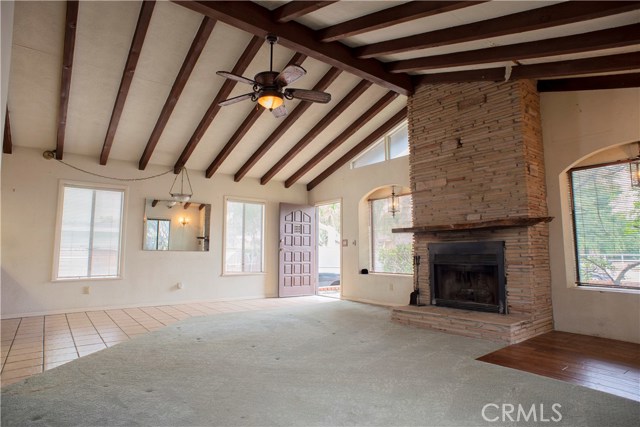 WOOD BEAMED VAULTED CEILINGS WITH FIREPLACE