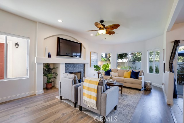 Beautiful light and bright open floor plan with fireplace in living room