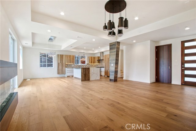 Shot of the magnificent open kitchen and the dining area from the living room.