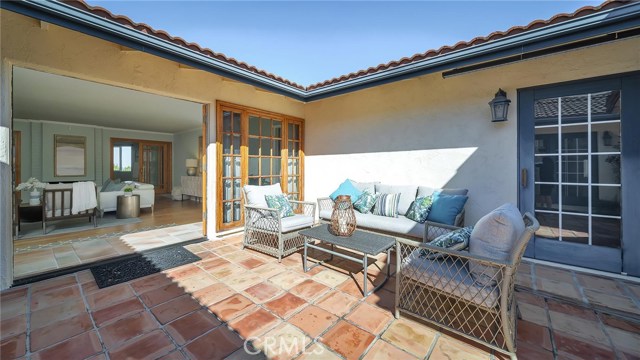 Living room view from courtyard to entry