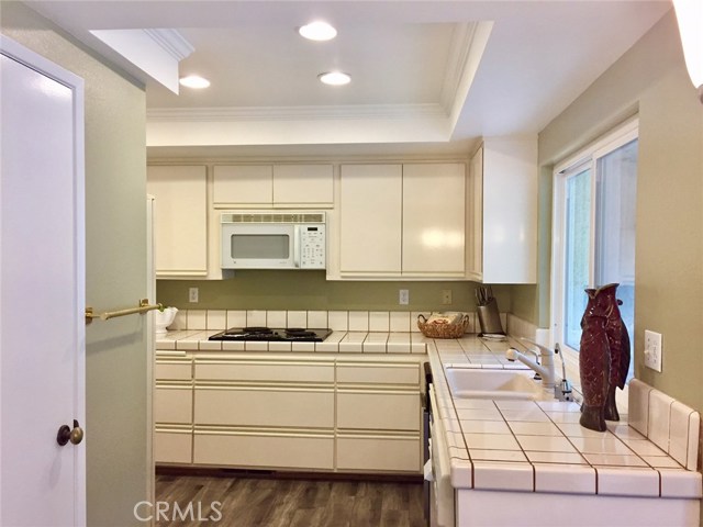 Updated kitchen has new flooring & walk in pantry. Updated kitchen has new flooring & walk in pantry.