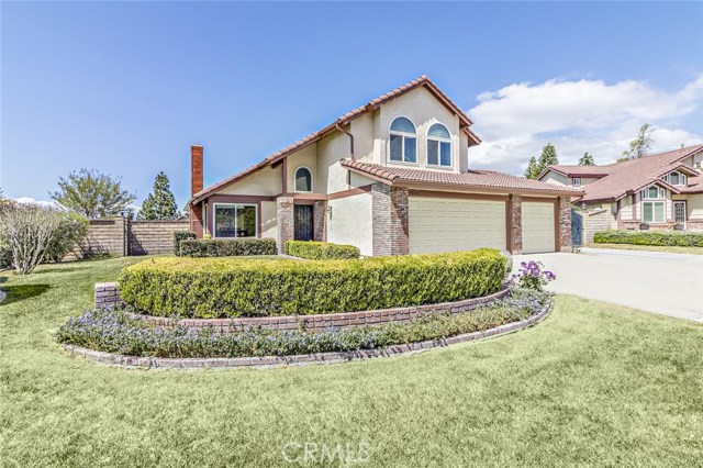 Great landscaping in the front of the home. Check out that 3 car garage!