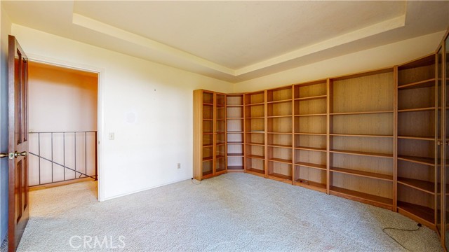 Upstairs bedroom with bookcases