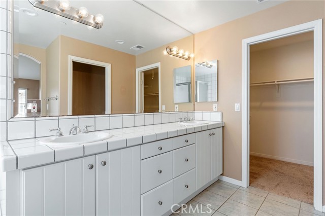 Dual vanity in main bedroom and walk-in closet