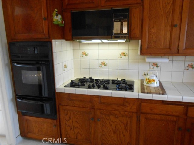 5 Gas Burner Cook Top and  Built-in Over Head Microwave with Vent and Cooking Lights.