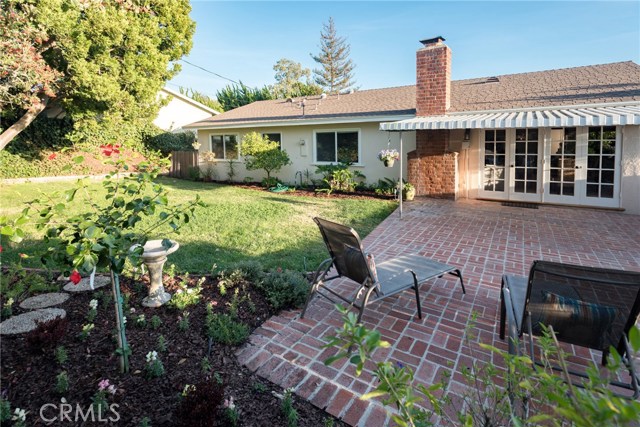 Back yard and rear view of house and patio