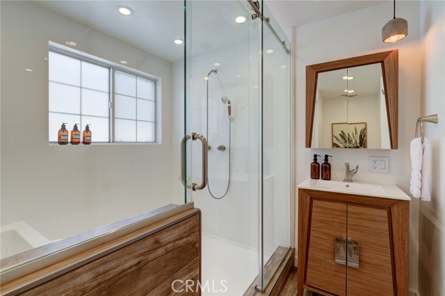 Hallway full bathroom with huge shower and soaking tub