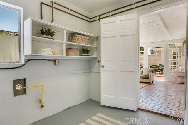 Spacious laundry room off family room and sun room