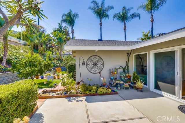 one of the patio areas in the spacious yard