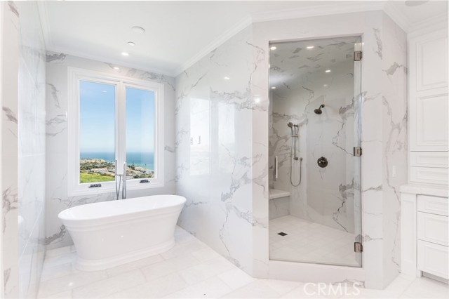 Master suite bathroom with soaking tub overlooking the ocean view