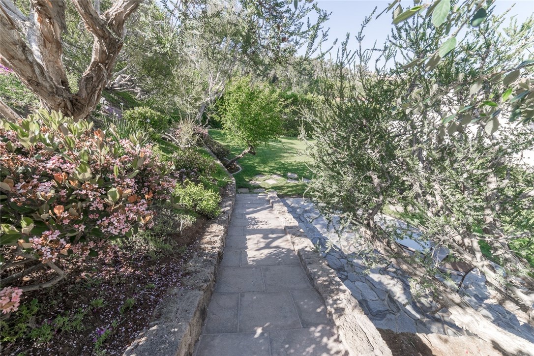 Walking back to your lush backyard professionally landscaped with butterflies included...